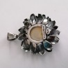 Sunflower-shaped pendant with decorative silver leaves