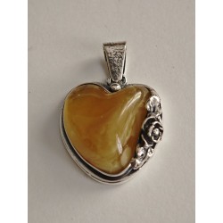 Unique pendant with small rose and natural amber. Set in 925 ster