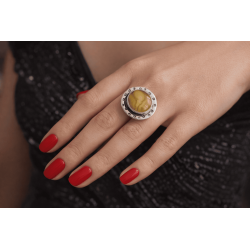 Ring with amber and unique pattern on silver setting