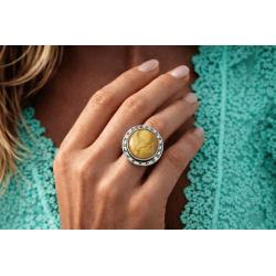 Ring with amber and unique pattern on silver setting