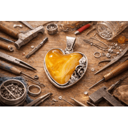Unique pendant with small rose and natural amber. Set in 925 ster