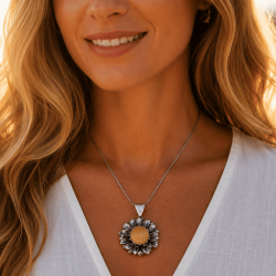 Sunflower-shaped pendant with decorative silver leaves