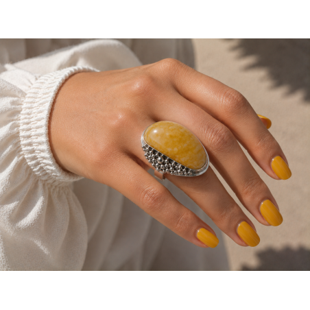Unique ring with elongated amber and exceptional silver bead sett
