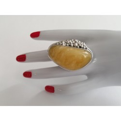 Unique ring with elongated amber and exceptional silver bead sett