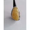 Unique ring with elongated amber and exceptional silver bead sett