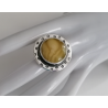 Ring with amber and unique pattern on silver setting